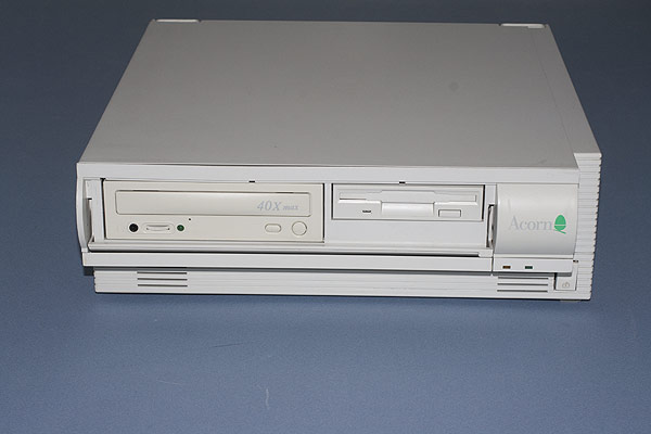 The RiscPC with the front panel opened revealing the 1.44MB floppy drive and CD-ROM drive.