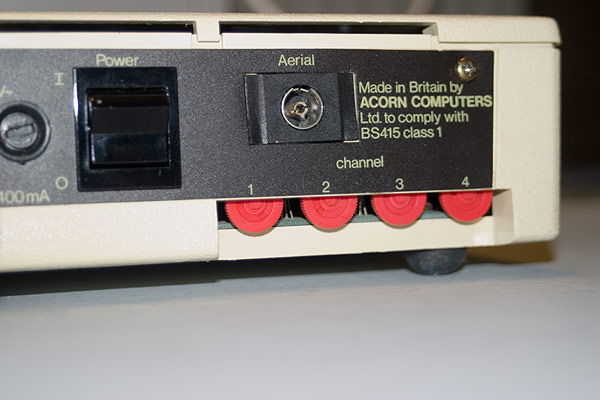 The rear aspect of the Acorn Teletext adapter detailing the power switch, Aerial socket and four tuning wheels